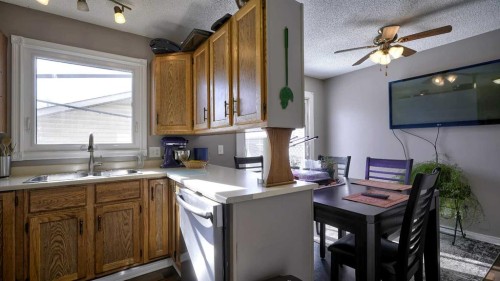 35 Riverbirch Road Se, Calgary, AB - Indoor Photo Showing Kitchen With Double Sink