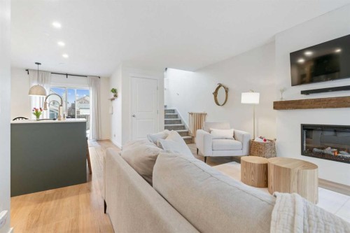 46 Prestwick Rise Se, Calgary, AB - Indoor Photo Showing Living Room With Fireplace