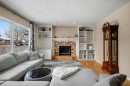 83 Deerbow Place Se, Calgary, AB  - Indoor Photo Showing Living Room With Fireplace 