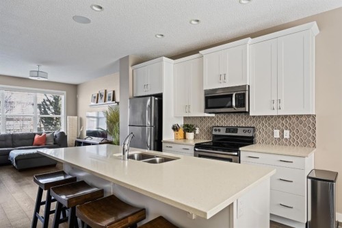 730 Walden Drive Se, Calgary, AB - Indoor Photo Showing Kitchen With Stainless Steel Kitchen With Double Sink With Upgraded Kitchen