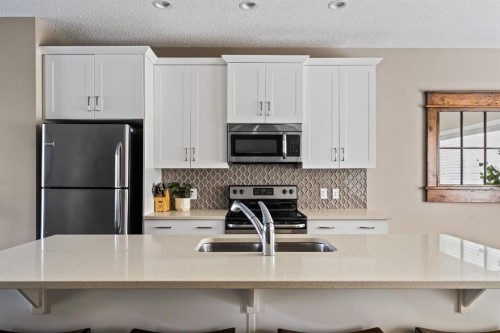 730 Walden Drive Se, Calgary, AB - Indoor Photo Showing Kitchen With Stainless Steel Kitchen With Double Sink With Upgraded Kitchen