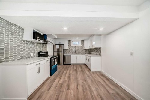 23 Marbank Way Ne, Calgary, AB - Indoor Photo Showing Kitchen With Upgraded Kitchen