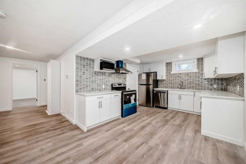 23 Marbank Way Ne, Calgary, AB - Indoor Photo Showing Kitchen With Upgraded Kitchen