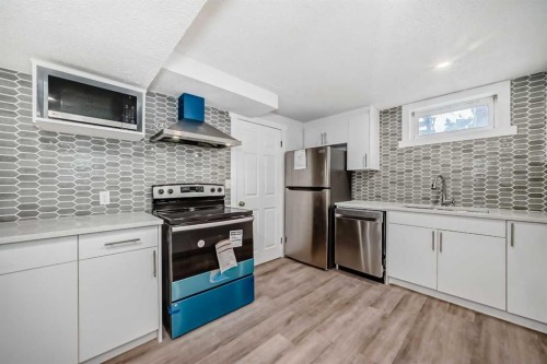 23 Marbank Way Ne, Calgary, AB - Indoor Photo Showing Kitchen With Upgraded Kitchen