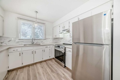23 Marbank Way Ne, Calgary, AB - Indoor Photo Showing Kitchen With Upgraded Kitchen