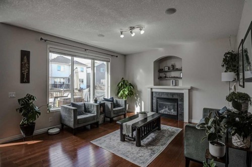 148 Copperfield Common Se, Calgary, AB - Indoor Photo Showing Living Room With Fireplace