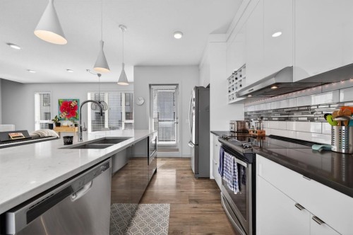 403 Bow Grove Nw, Calgary, AB - Indoor Photo Showing Kitchen With Stainless Steel Kitchen With Double Sink With Upgraded Kitchen
