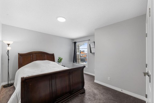 308 Lucas Way Nw, Calgary, AB - Indoor Photo Showing Bedroom