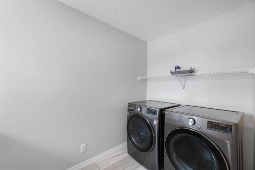 308 Lucas Way Nw, Calgary, AB - Indoor Photo Showing Laundry Room