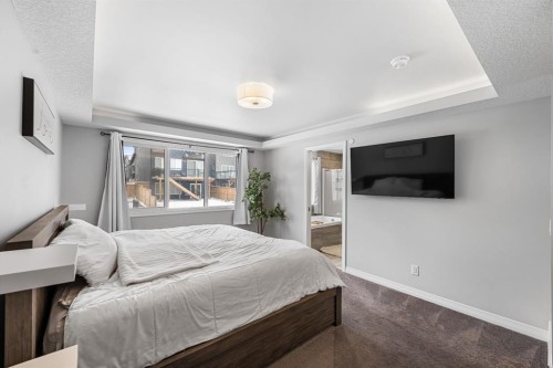 308 Lucas Way Nw, Calgary, AB - Indoor Photo Showing Bedroom