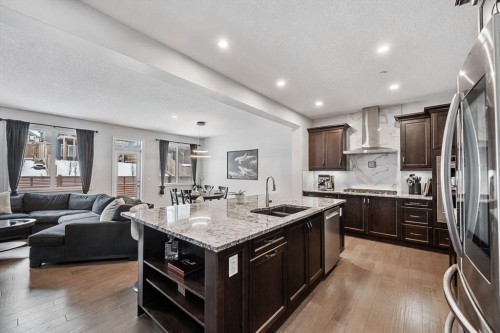 308 Lucas Way Nw, Calgary, AB - Indoor Photo Showing Kitchen With Double Sink With Upgraded Kitchen