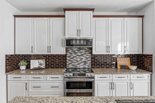 30 Ranchers Crescent, Okotoks, AB - Indoor Photo Showing Kitchen With Upgraded Kitchen