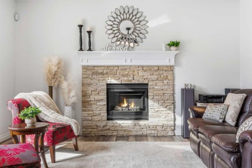 30 Ranchers Crescent, Okotoks, AB - Indoor Photo Showing Living Room With Fireplace