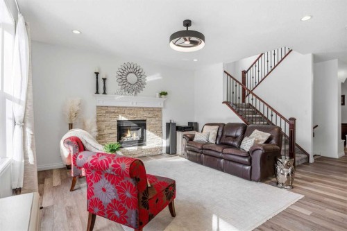 30 Ranchers Crescent, Okotoks, AB - Indoor Photo Showing Living Room With Fireplace