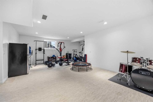 30 Ranchers Crescent, Okotoks, AB - Indoor Photo Showing Gym Room