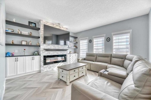 260 Ranch Close, Strathmore, AB - Indoor Photo Showing Living Room With Fireplace