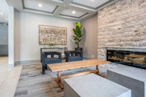 3103-80 Greenbriar Place Nw, Calgary, AB - Indoor Photo Showing Living Room With Fireplace