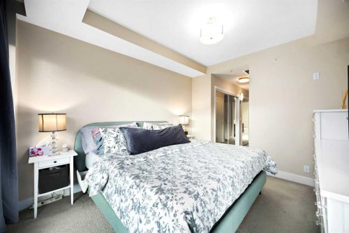 574 Riverfront Lane Se, Calgary, AB - Indoor Photo Showing Bedroom