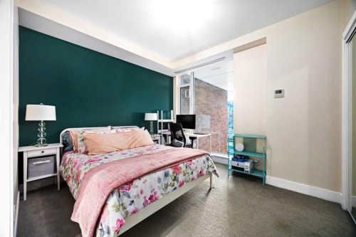 574 Riverfront Lane Se, Calgary, AB - Indoor Photo Showing Bedroom