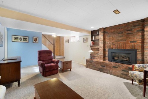 59 Hogarth Crescent Sw, Calgary, AB - Indoor With Fireplace
