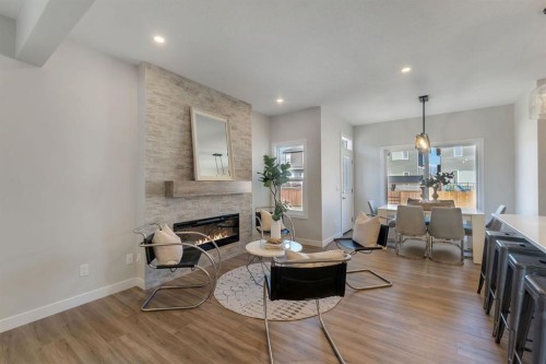11 Fireside Common, Cochrane, AB - Indoor Photo Showing Living Room With Fireplace