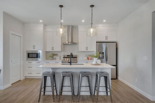 11 Fireside Common, Cochrane, AB - Indoor Photo Showing Kitchen With Stainless Steel Kitchen With Upgraded Kitchen