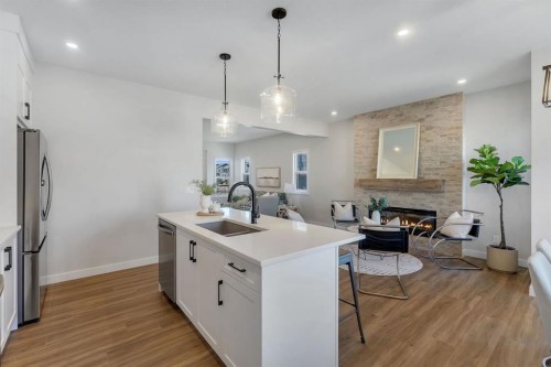 11 Fireside Common, Cochrane, AB - Indoor Photo Showing Kitchen With Upgraded Kitchen
