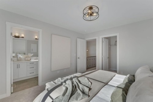 11 Fireside Common, Cochrane, AB - Indoor Photo Showing Bedroom