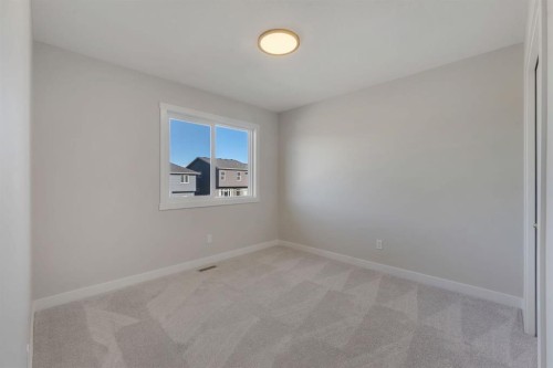 11 Fireside Common, Cochrane, AB - Indoor Photo Showing Other Room