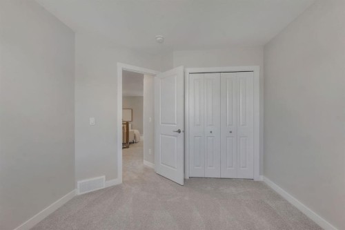 11 Fireside Common, Cochrane, AB - Indoor Photo Showing Other Room