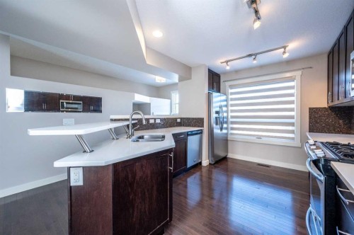 57 Aspen Hills Common Sw, Calgary, AB - Indoor Photo Showing Kitchen With Double Sink