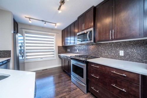 57 Aspen Hills Common Sw, Calgary, AB - Indoor Photo Showing Kitchen With Stainless Steel Kitchen With Upgraded Kitchen