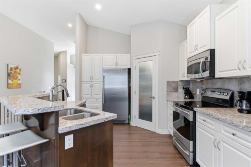 1151 Westmount Drive, Strathmore, AB - Indoor Photo Showing Kitchen With Stainless Steel Kitchen With Double Sink With Upgraded Kitchen
