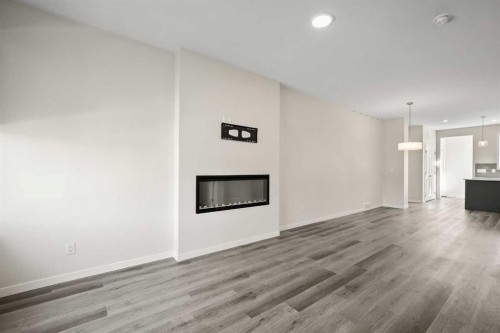 1224 Cornerstone Boulevard Ne, Calgary, AB - Indoor Photo Showing Living Room With Fireplace