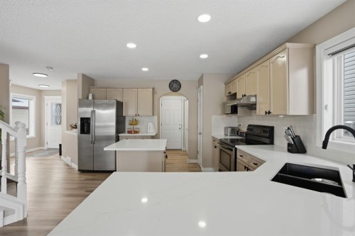 235 Coville Close Ne, Calgary, AB - Indoor Photo Showing Kitchen With Double Sink