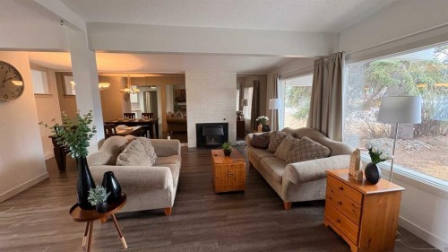 10212 7 Street Sw, Calgary, AB - Indoor Photo Showing Living Room With Fireplace