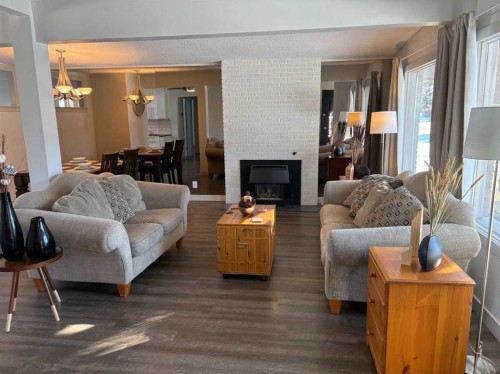 10212 7 Street Sw, Calgary, AB - Indoor Photo Showing Living Room With Fireplace