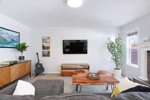 54 Springborough Point Sw, Calgary, AB - Indoor Photo Showing Living Room With Fireplace