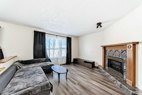 136 Citadel Crest Circle Nw, Calgary, AB - Indoor Photo Showing Living Room With Fireplace