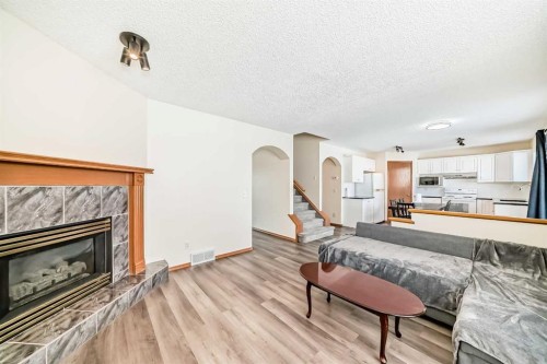 136 Citadel Crest Circle Nw, Calgary, AB - Indoor Photo Showing Living Room With Fireplace