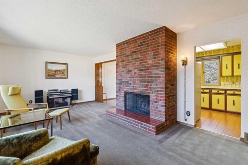 7223 Bow Crescent Nw, Calgary, AB - Indoor Photo Showing Living Room With Fireplace
