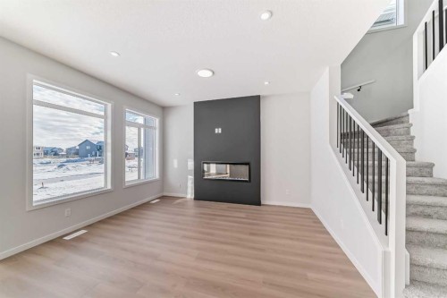374 Corner Glen Way Ne, Calgary, AB - Indoor Photo Showing Other Room With Fireplace