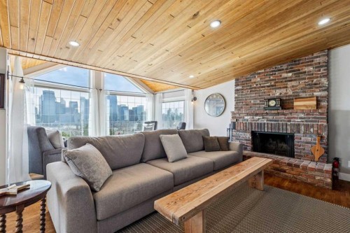 228 Crescent Road Nw, Calgary, AB - Indoor Photo Showing Living Room With Fireplace