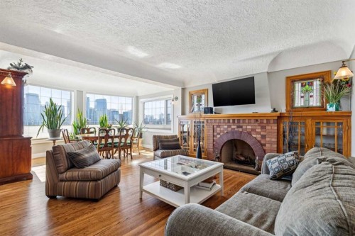 228 Crescent Road Nw, Calgary, AB - Indoor Photo Showing Living Room With Fireplace