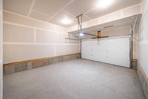 73 Royston Grove Nw, Calgary, AB - Indoor Photo Showing Garage