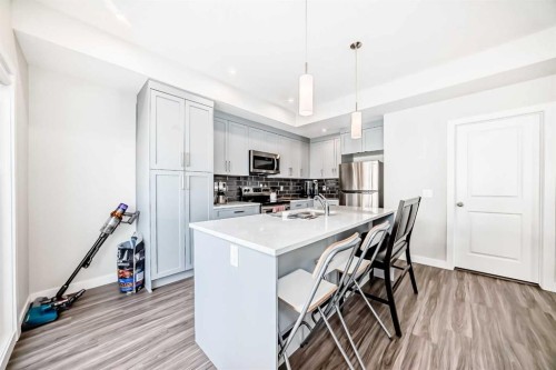 294 Canals Crossing Sw, Airdrie, AB - Indoor Photo Showing Kitchen With Upgraded Kitchen