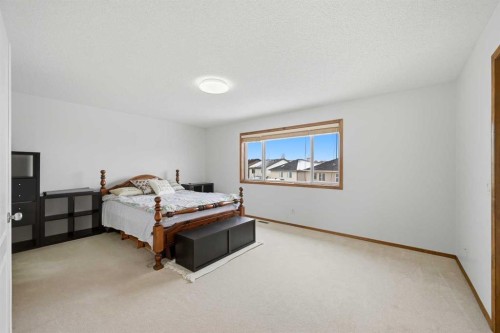 125 Panamount Heath Nw, Calgary, AB - Indoor Photo Showing Bedroom