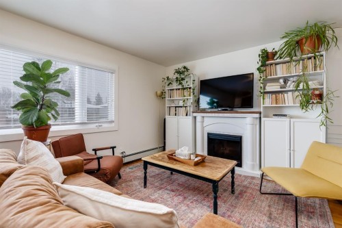11 Foley Road Se, Calgary, AB - Indoor Photo Showing Living Room With Fireplace
