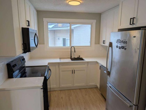 528 Queensland Place Se, Calgary, AB - Indoor Photo Showing Kitchen