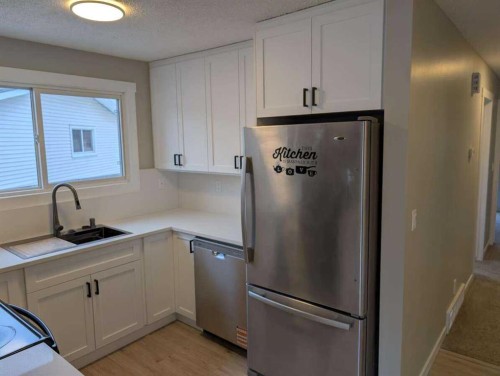 528 Queensland Place Se, Calgary, AB - Indoor Photo Showing Kitchen